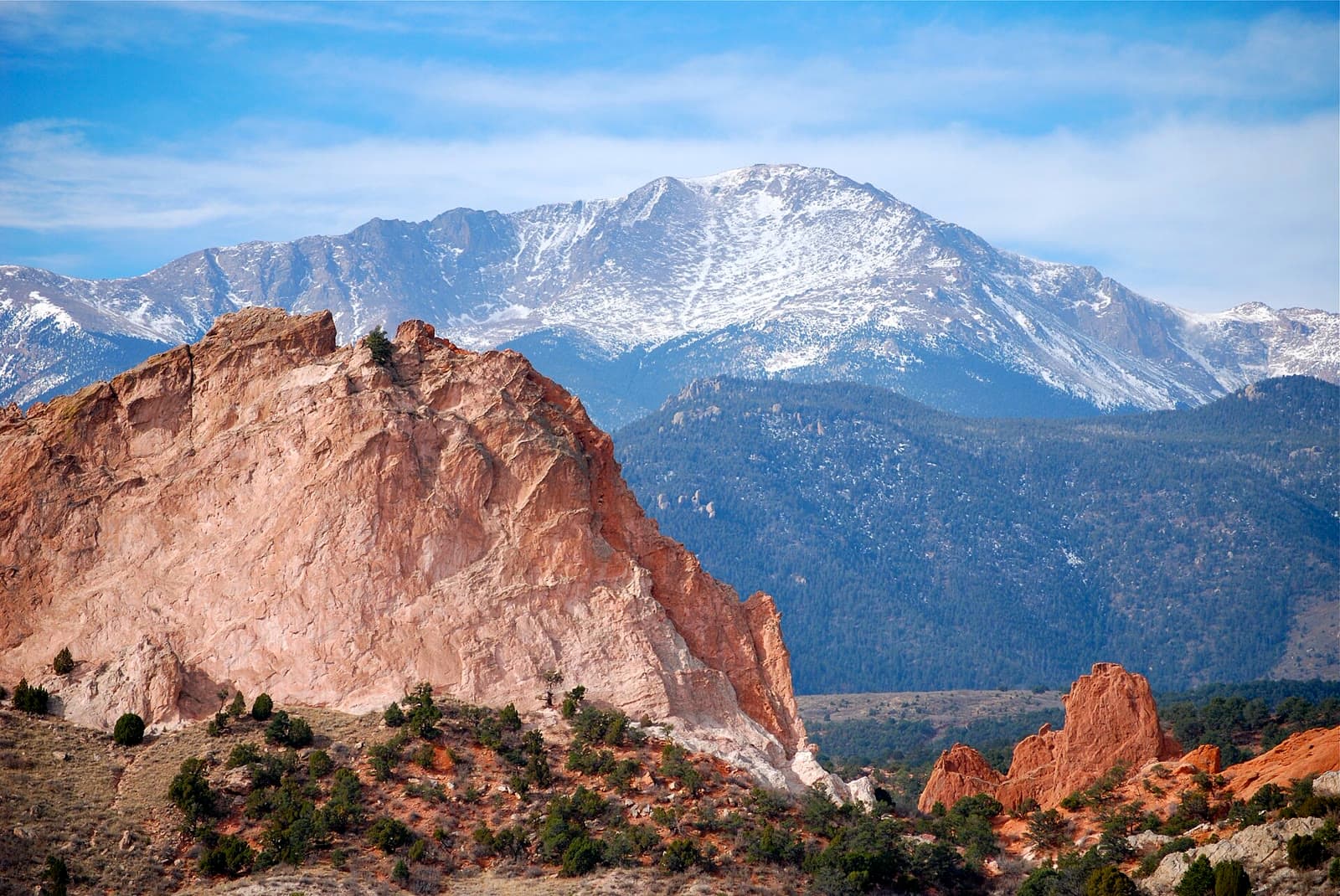 Snow-capped Pikes Peak behind the red rocks of Garden of the Gods: Rockstarr Media is casting new faces in Colorado Springs