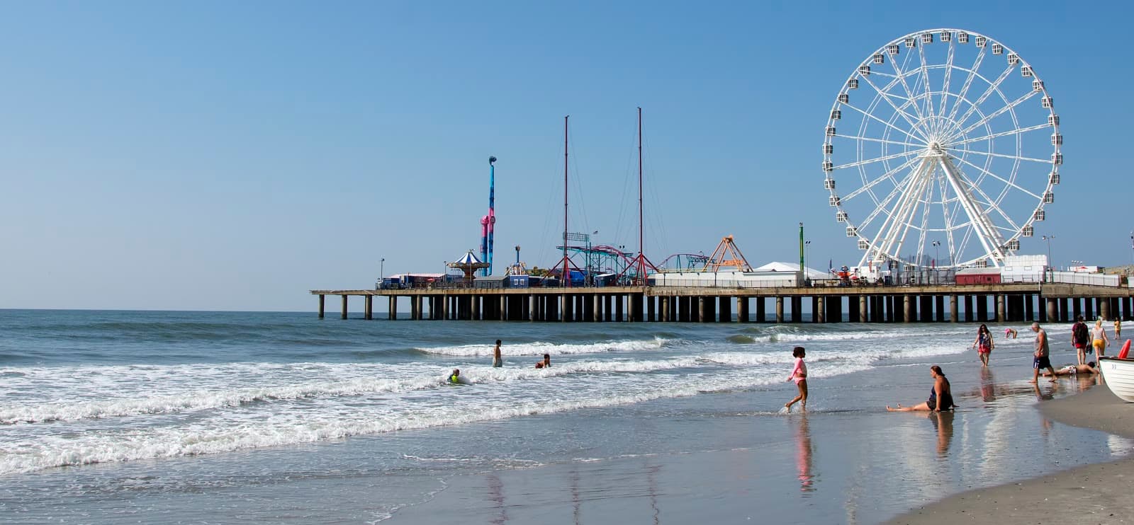 The Steel Pier and its Ferris wheel seen from the beach on a clear morning: Rockstarr Media is casting new faces in Atlantic City