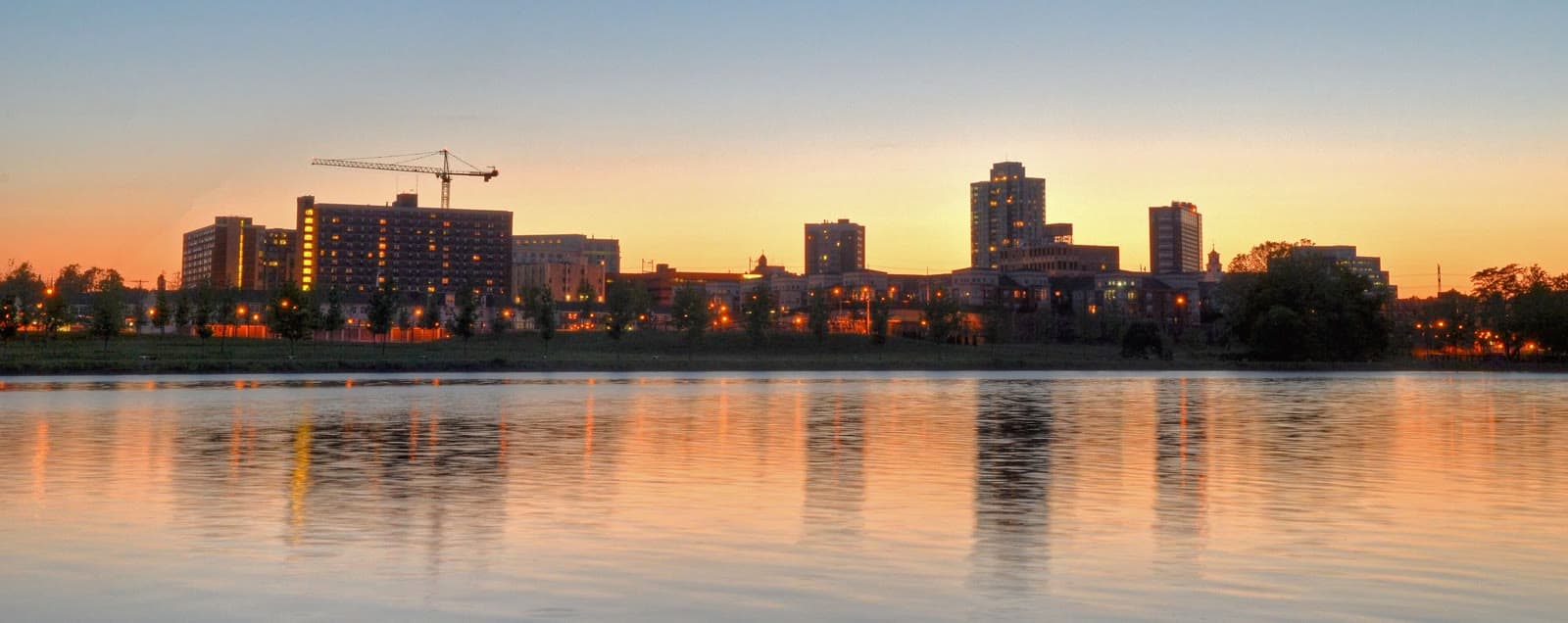 Downtown New Brunswick at sunset across the Raritan River: Rockstarr Media is casting new faces in New Brunswick