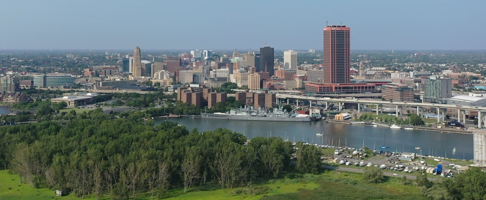 The downtown Buffalo skyline over the Buffalo River and the harbor: Rockstarr Media is casting new faces in Buffalo