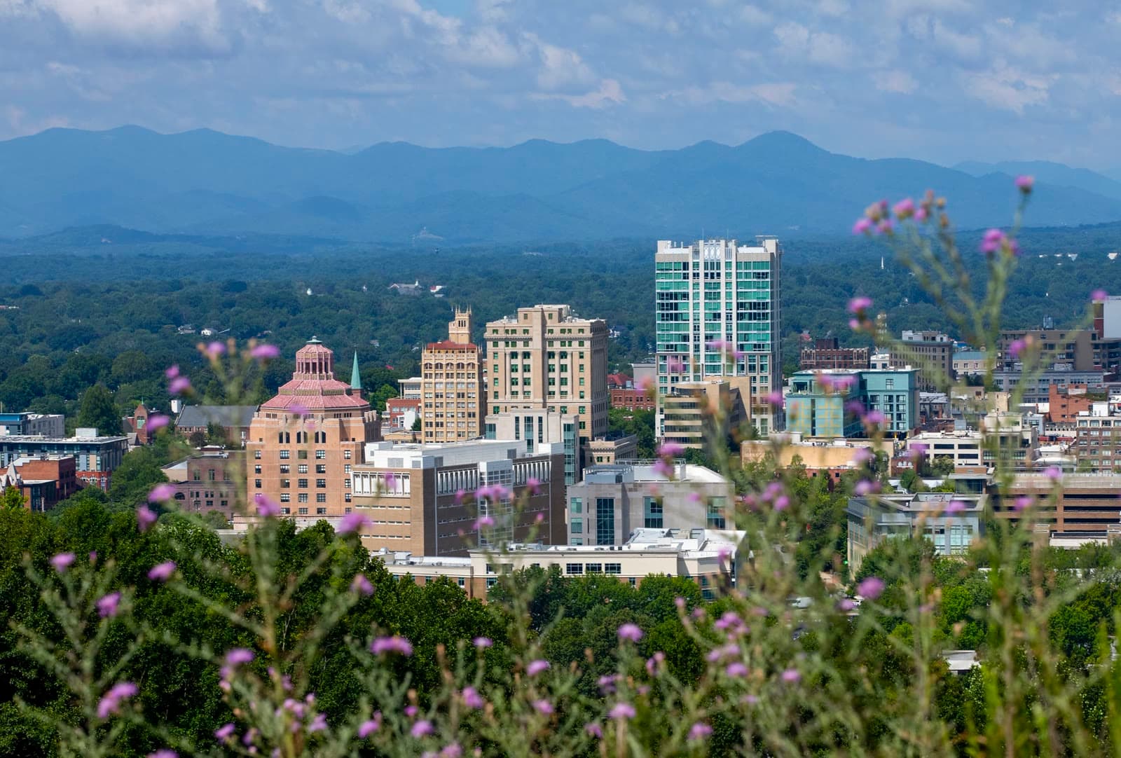 Downtown Asheville framed by the Blue Ridge Mountains: Rockstarr Media is casting new faces in Asheville