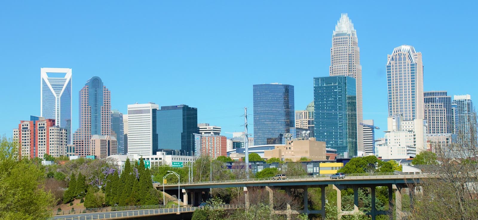 The Uptown Charlotte skyline under a clear blue sky: Rockstarr Media is casting new faces in Charlotte