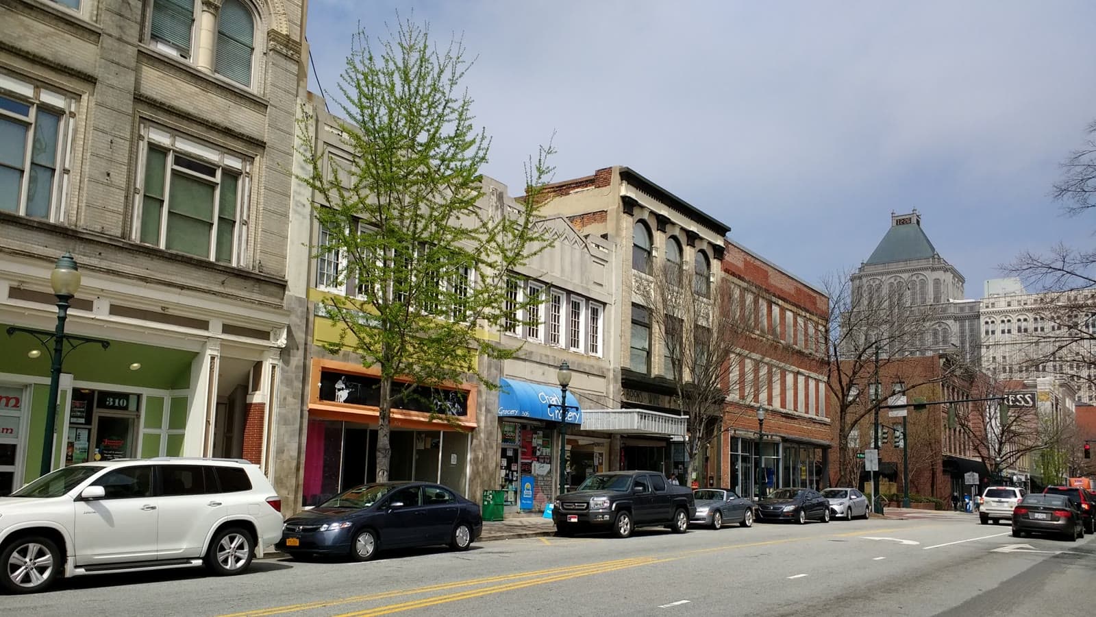 The brick storefronts of South Elm Street in downtown Greensboro: Rockstarr Media is casting new faces in Greensboro