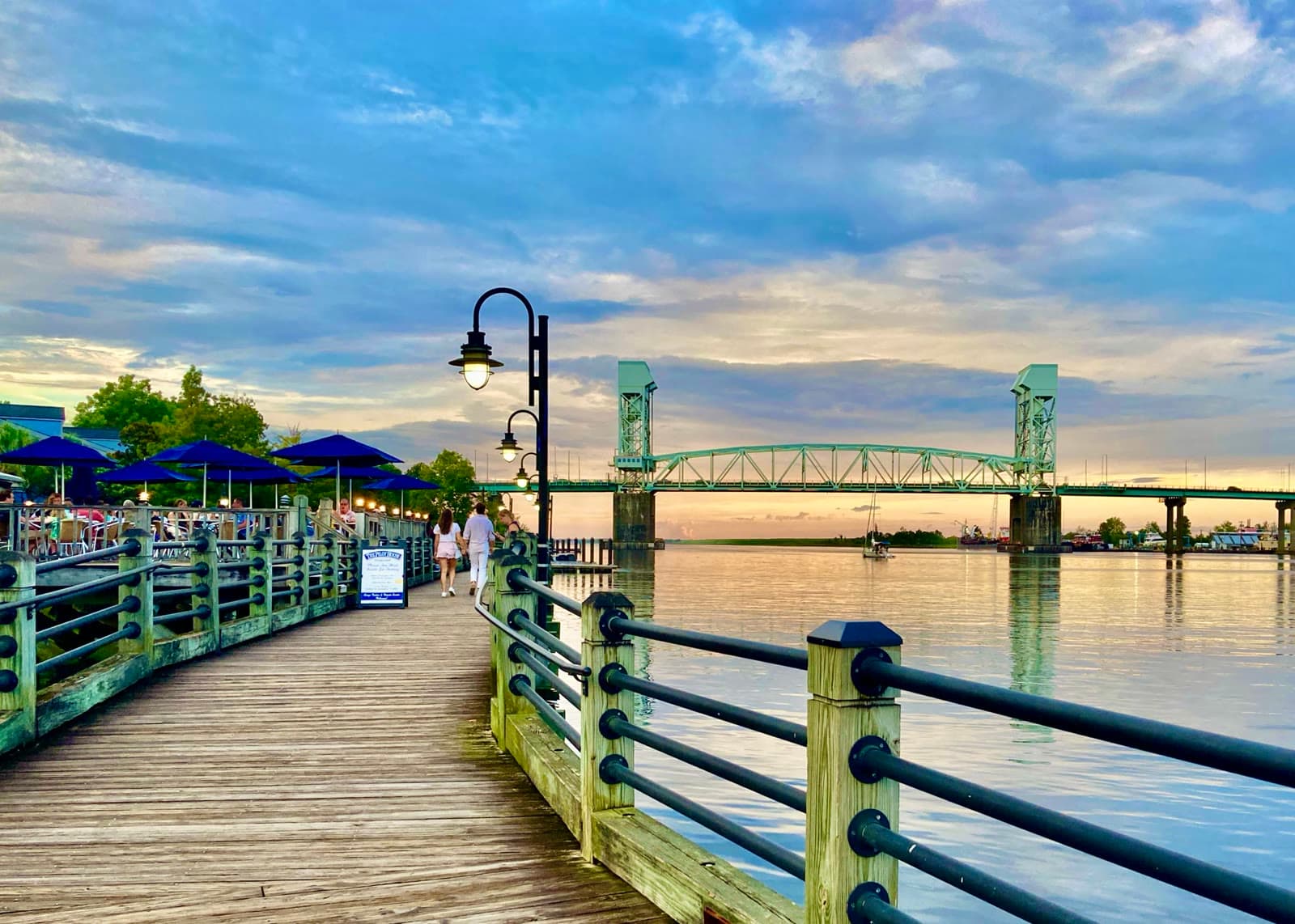 The Wilmington Riverwalk and the Cape Fear Memorial Bridge at sunset: Rockstarr Media is casting new faces in Wilmington