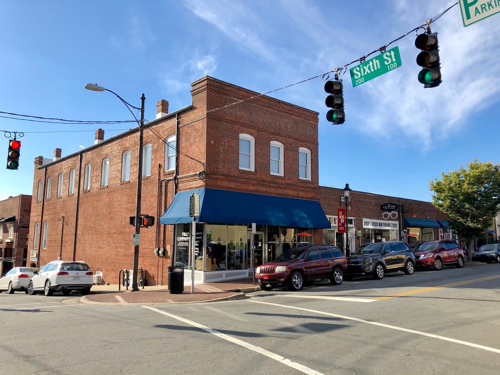 Red-brick storefronts on Trade Street in downtown Winston-Salem: Rockstarr Media is casting new faces in Winston-Salem