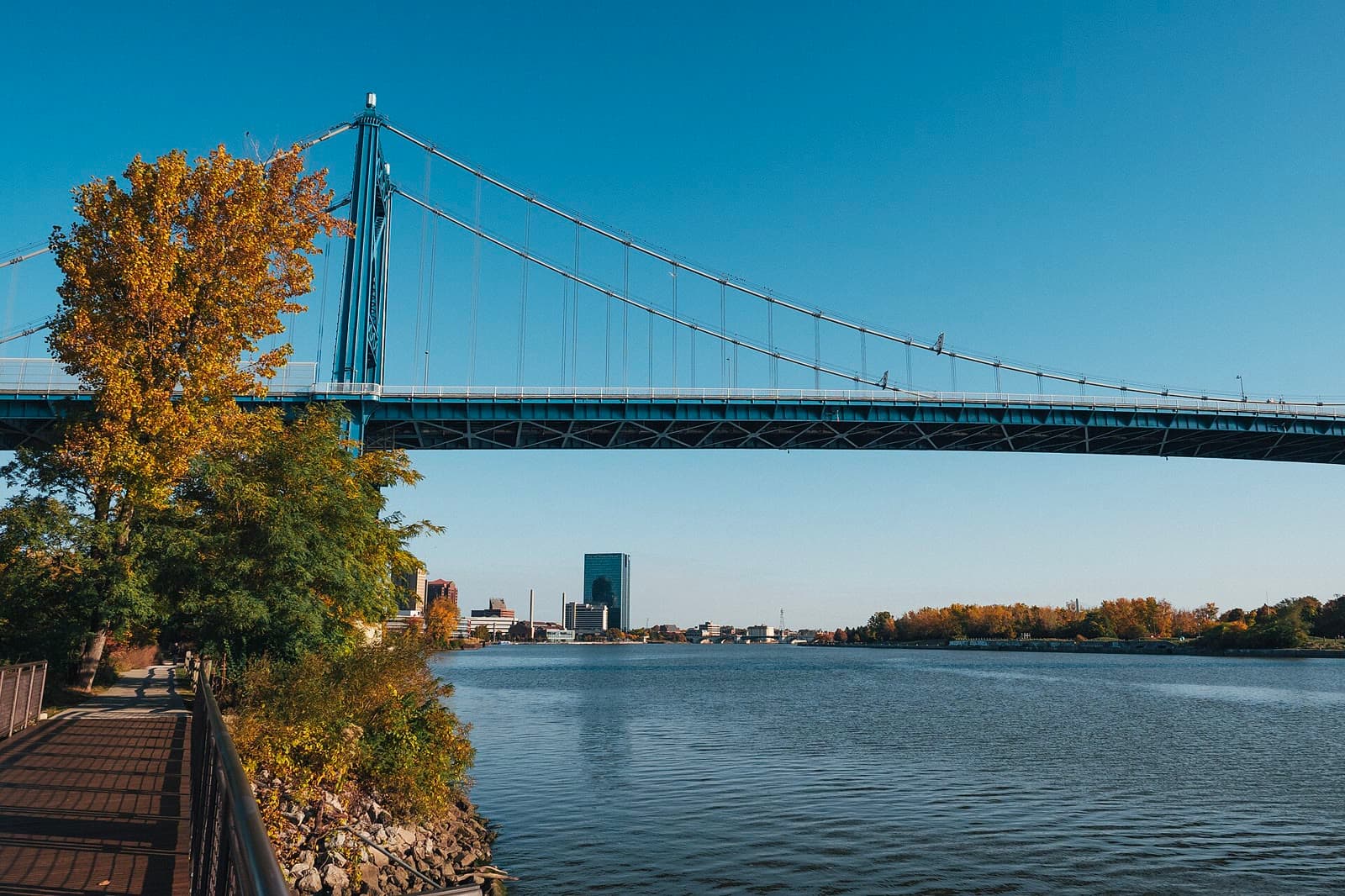 The blue Anthony Wayne Bridge over the Maumee River in fall, with downtown Toledo on the horizon: Rockstarr Media is casting new faces in Toledo