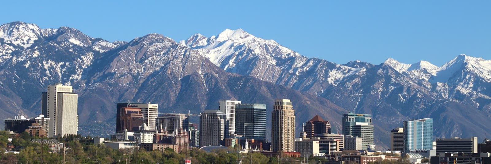 Downtown Salt Lake City under the snow-capped Wasatch Range: Rockstarr Media is casting new faces in Salt Lake City