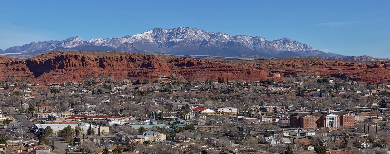 St. George below its red sandstone bluffs and the Pine Valley Mountains: Rockstarr Media is casting new faces in St. George