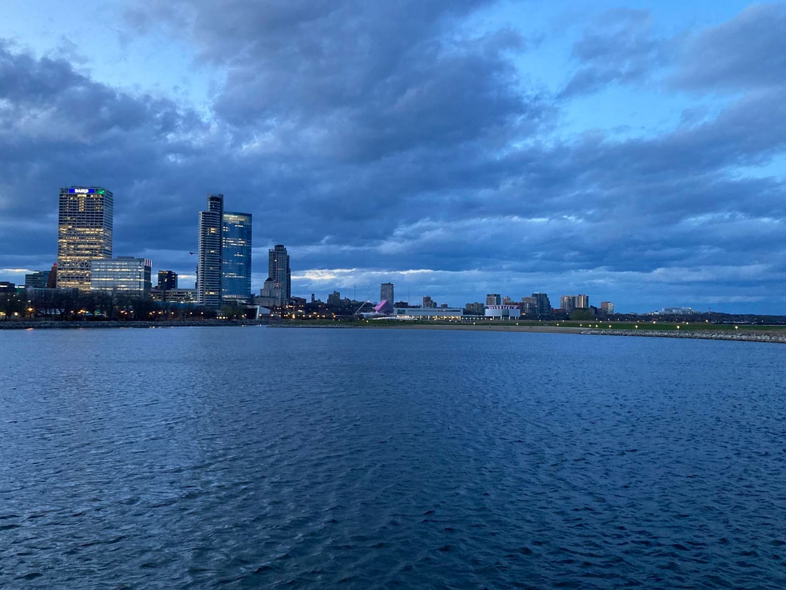 The Milwaukee skyline across Lake Michigan at dusk: Rockstarr Media is casting new faces in Milwaukee